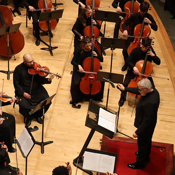 Ransom Wilson conducting the Huxford Symphony Orchestra