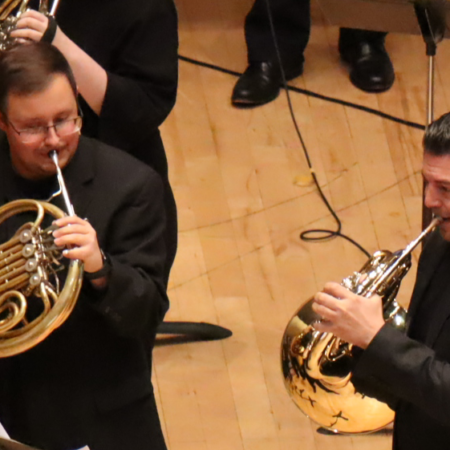 Matt Meadows and Josh Pantoja playing French Horn